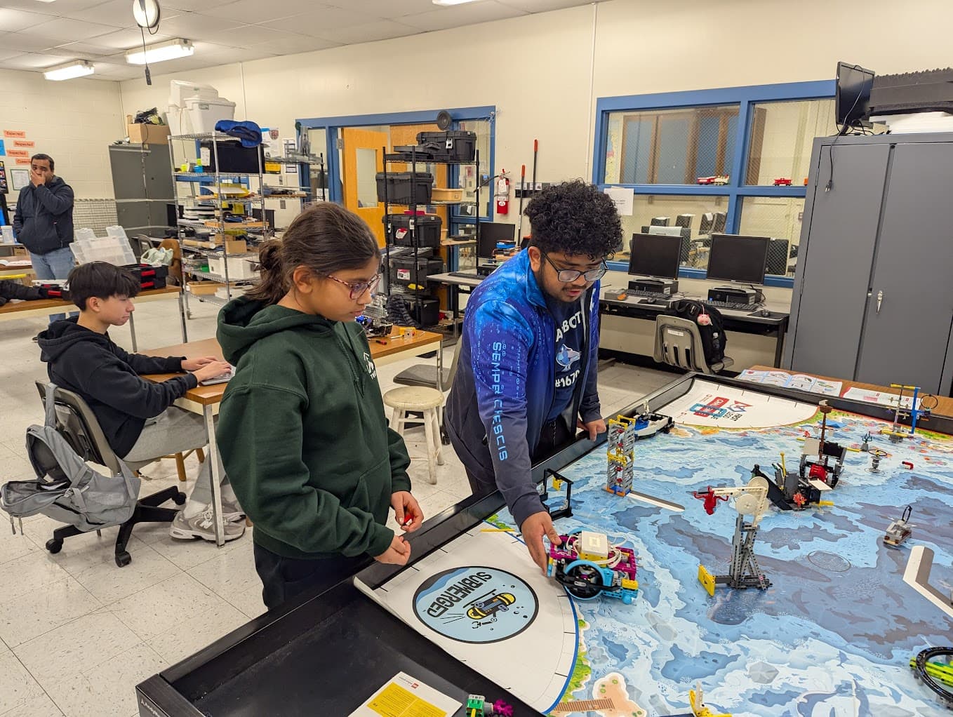 Anthony helping students with FLL