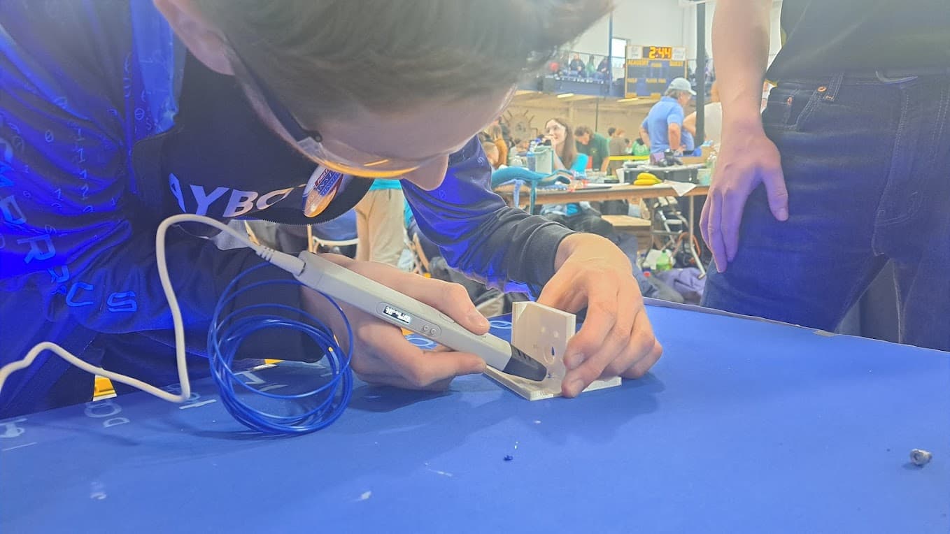 Matt fixing another team's robot