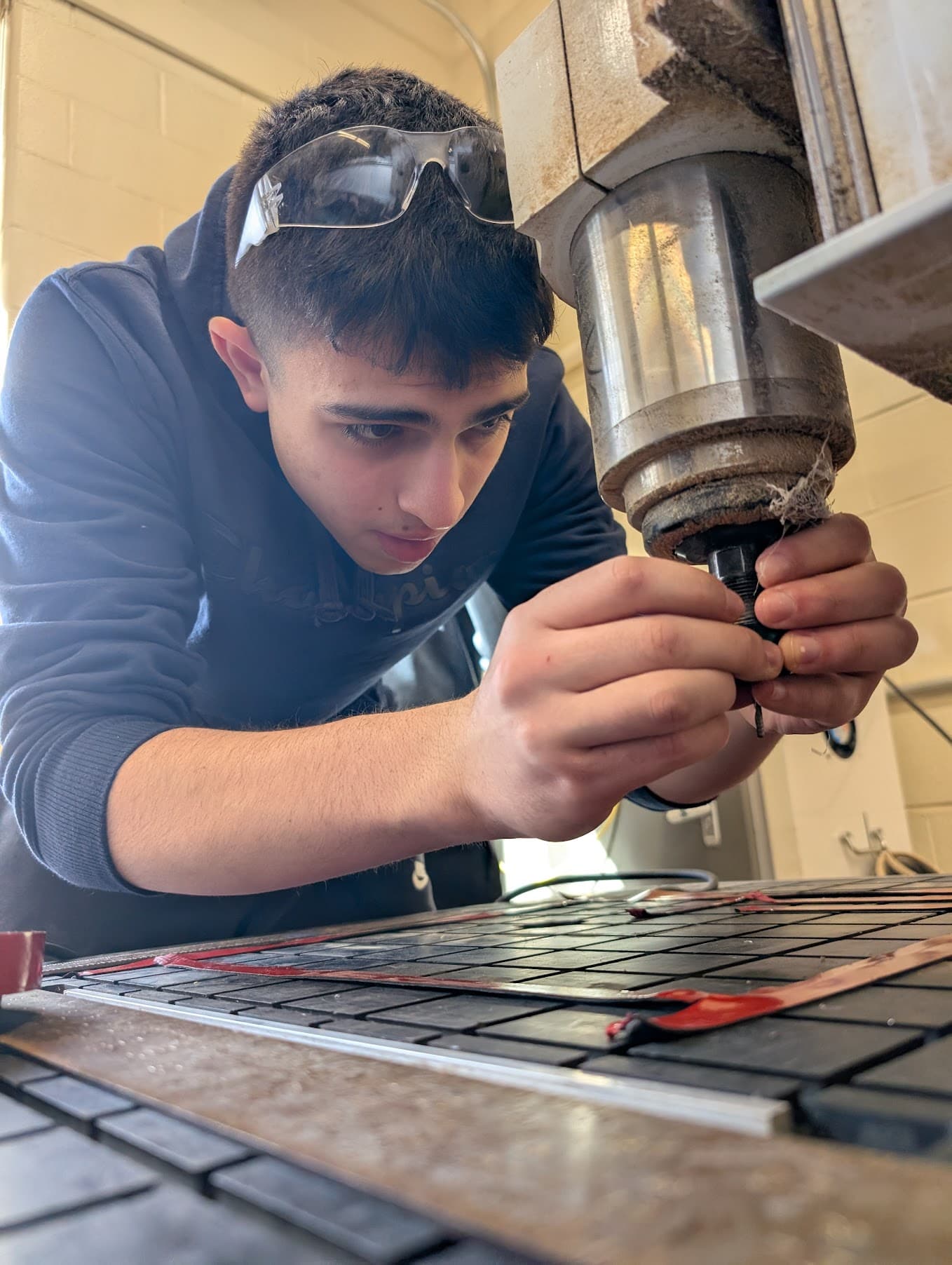 Joey changing screw on CNC