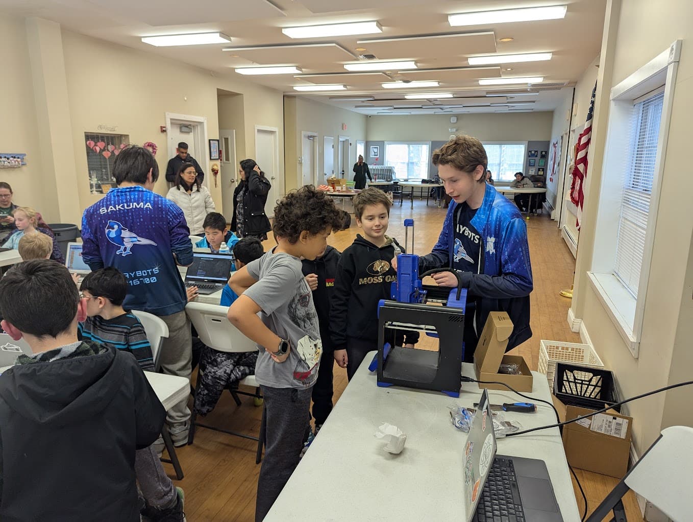 Matt showing elementary students about Chocolate 3D printers.