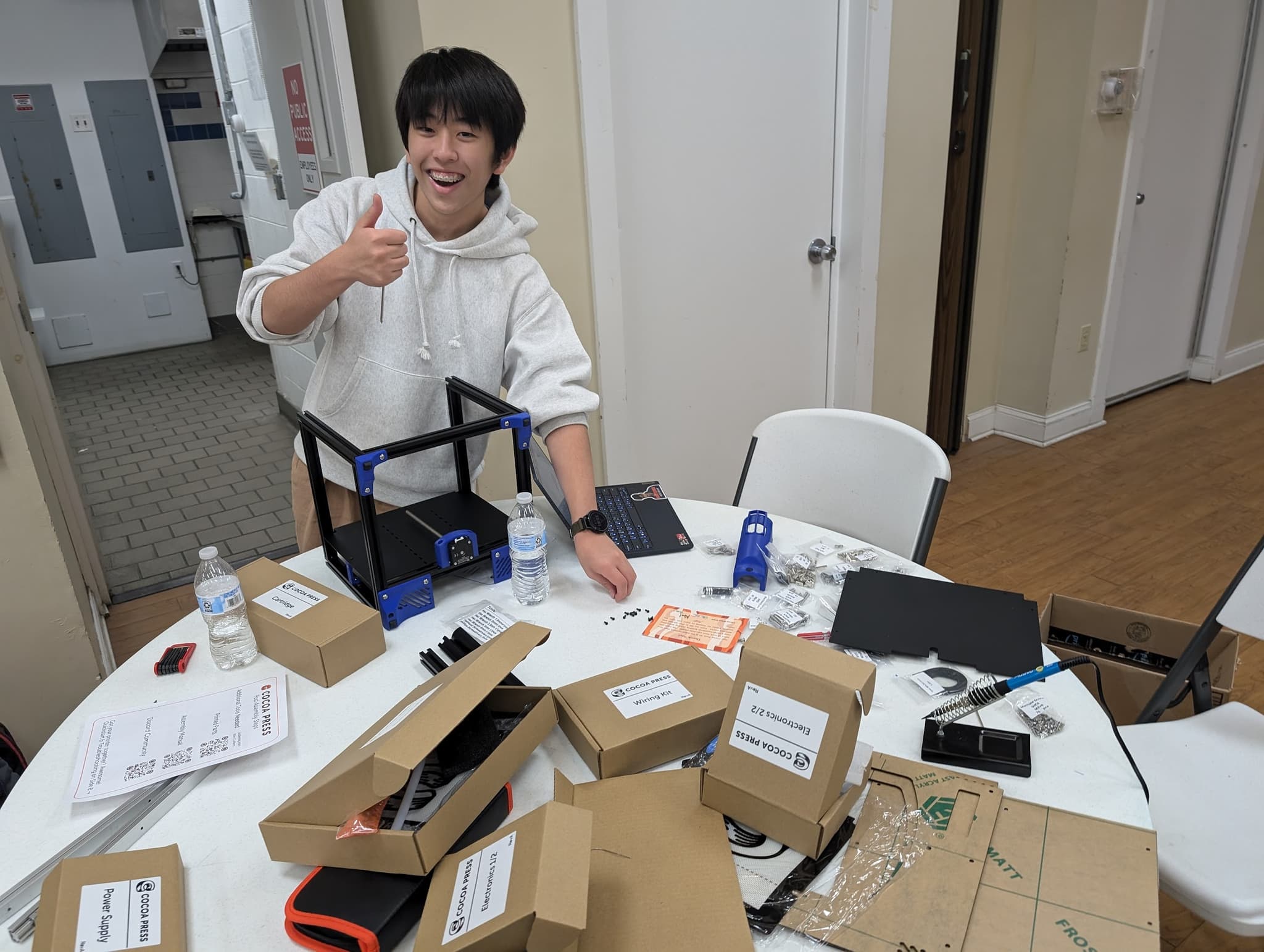 Hiro working on assembling chocolate 3D printer.