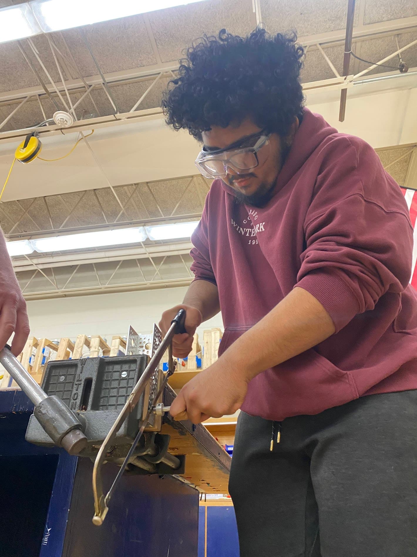 Anthony sawing custom chassis.