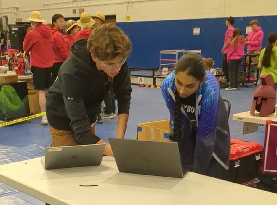 Anika printing out a part for another teacher.