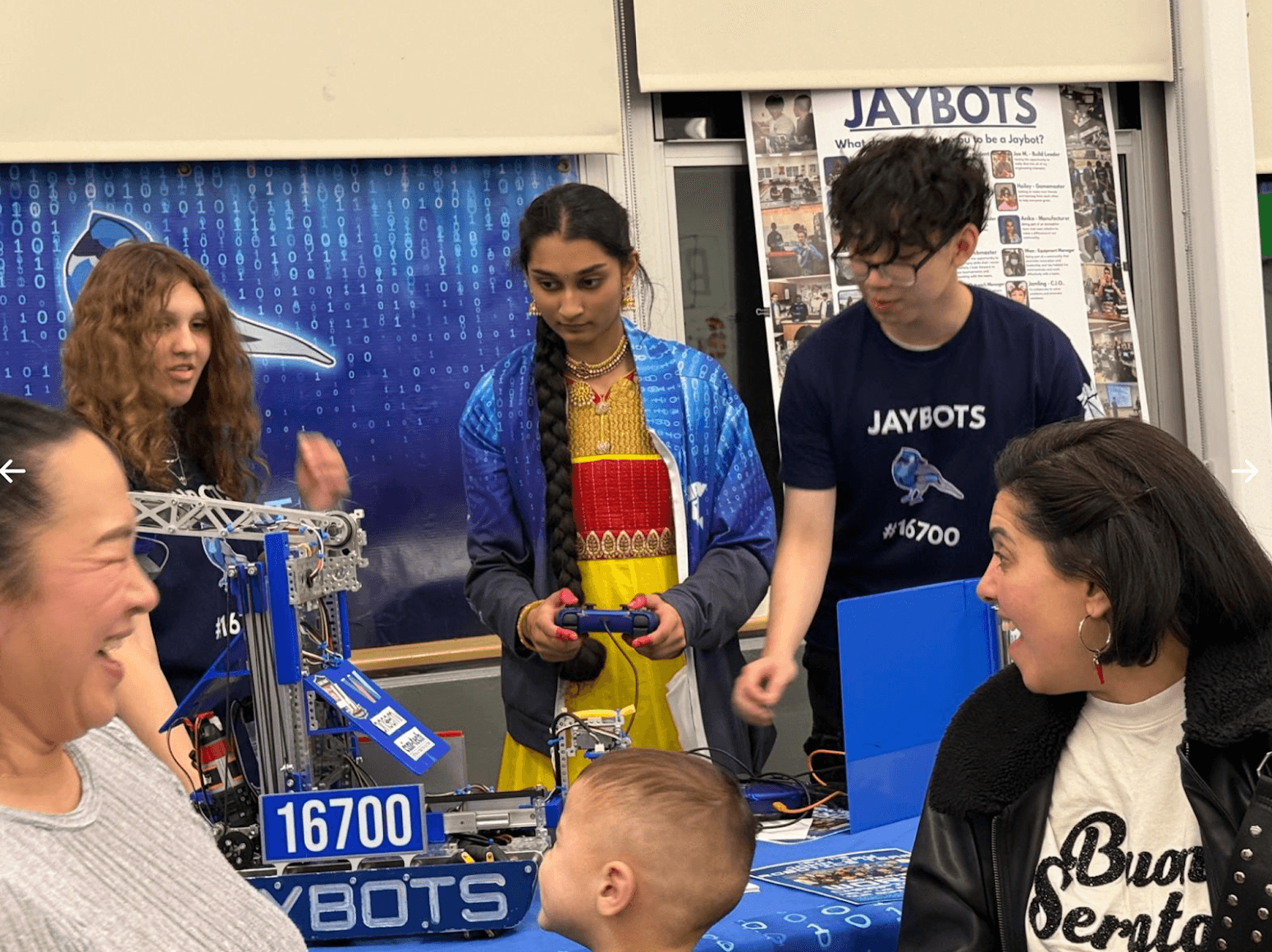 Anika demonstrating our robot at International Night